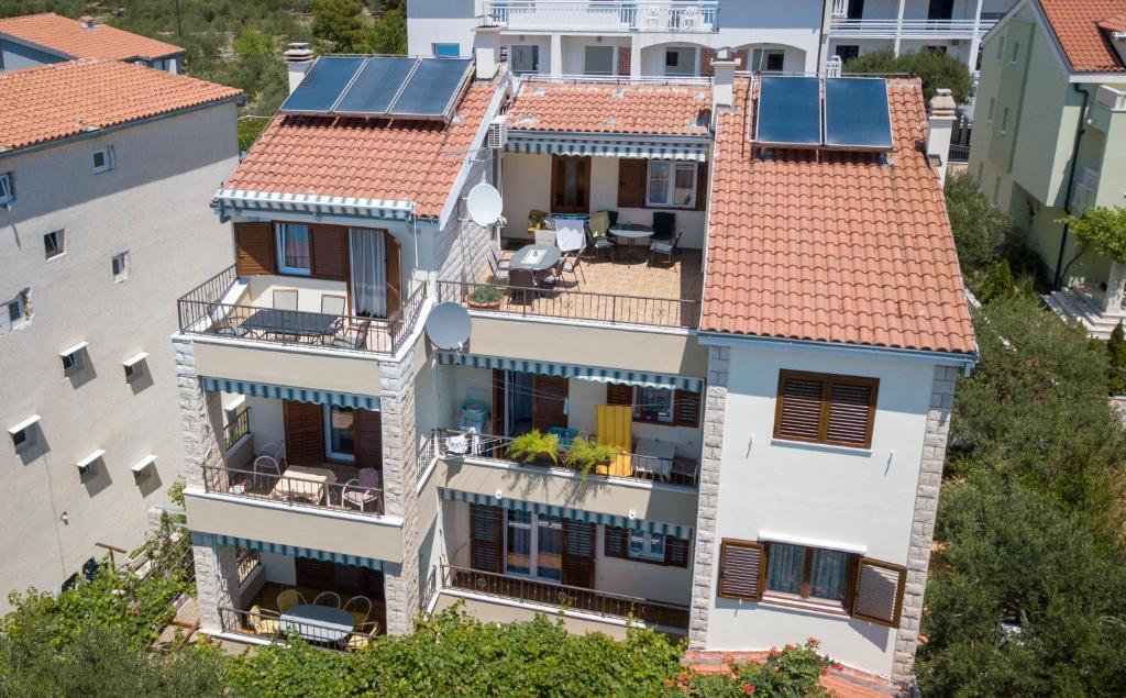 an aerial view of a house with solar panels on its roof at Apartments Bašković in Promajna