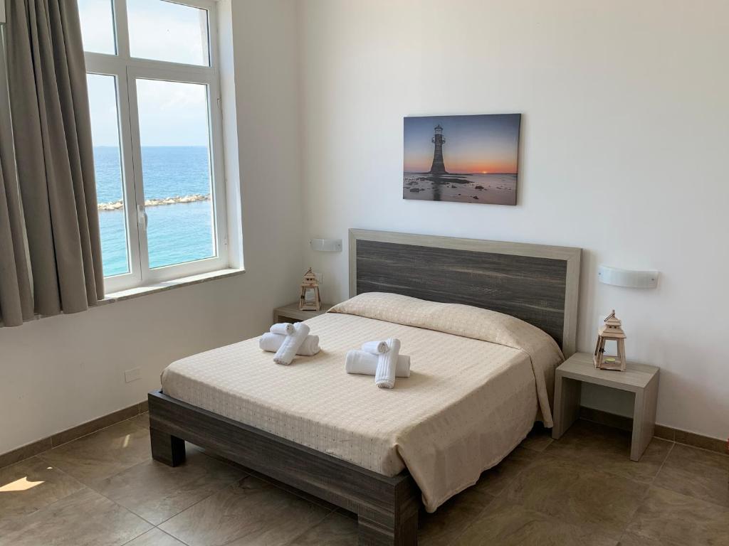 Postel nebo postele na pokoji v ubytování Hotel Virgilio