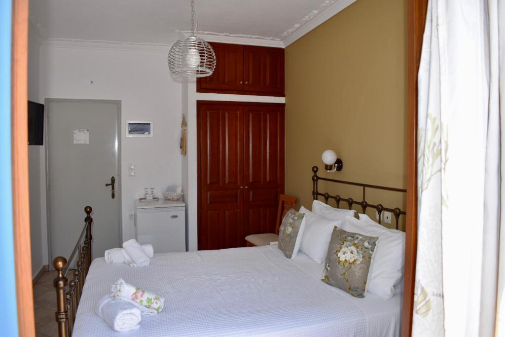 Postel nebo postele na pokoji v ubytování Minoa Hotel