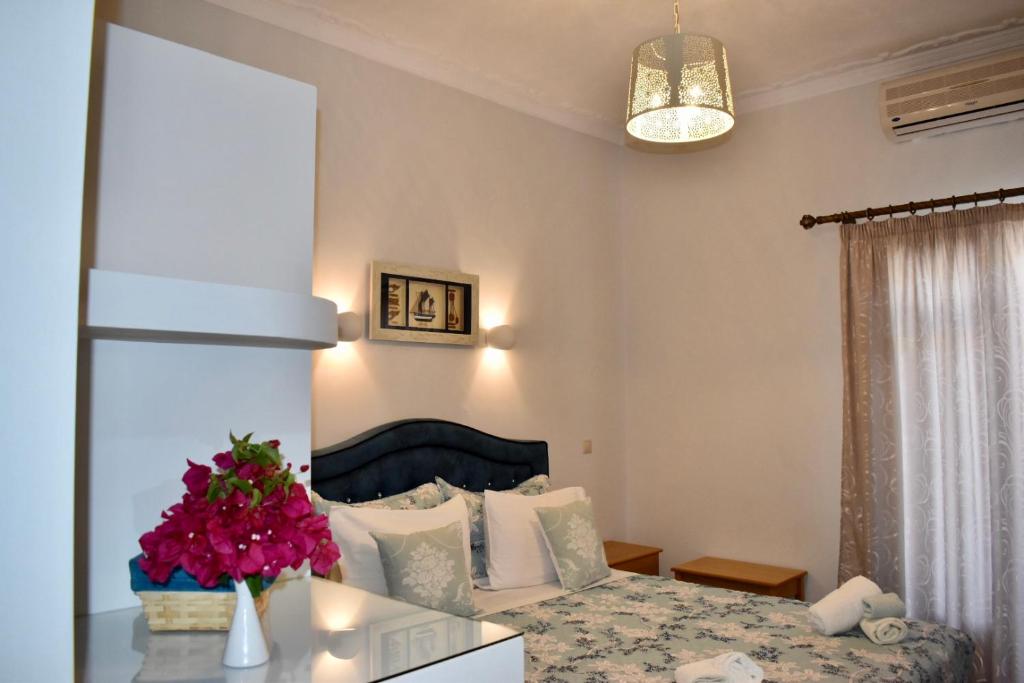 Postel nebo postele na pokoji v ubytování Minoa Hotel
