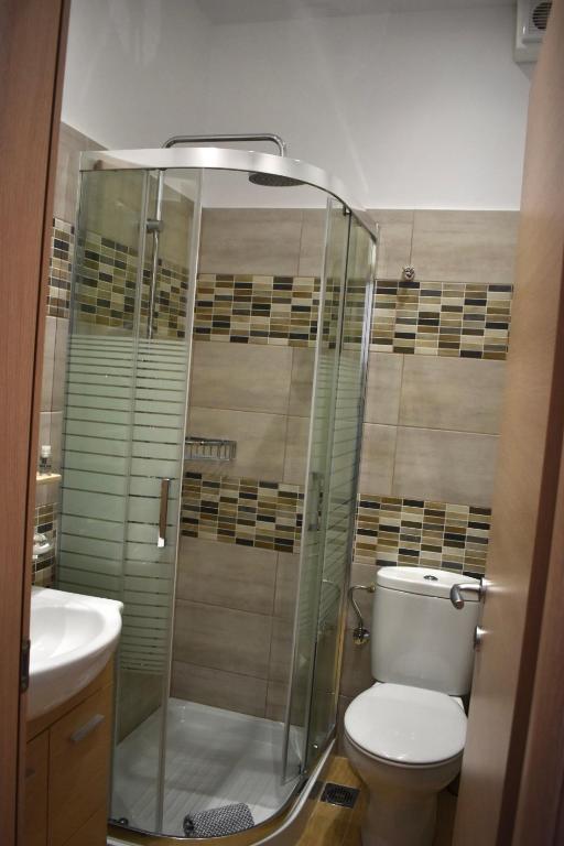 Koupelna v ubytování Minoa Hotel