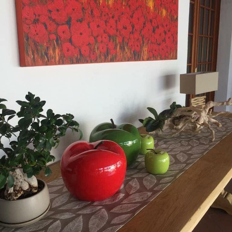a table with some green and red vegetables on it at Hotel La Favorita in Peschiera del Garda
