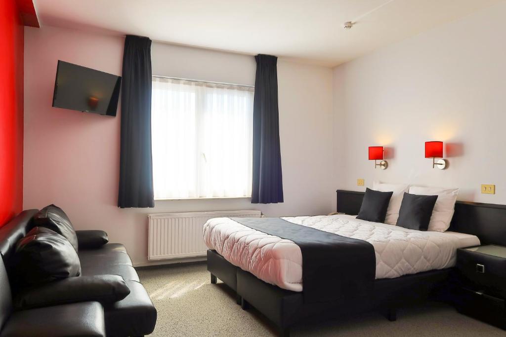 Postel nebo postele na pokoji v ubytování Hotel Adoma