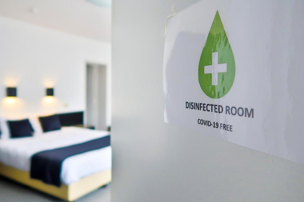 Postel nebo postele na pokoji v ubytování Hotel Adoma