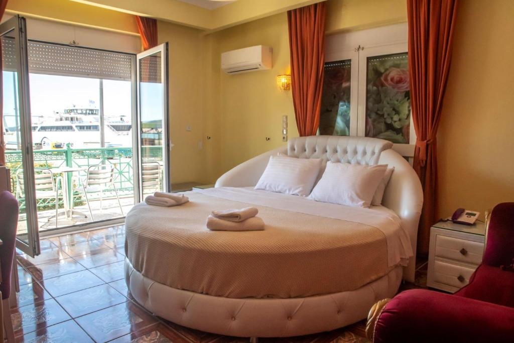 Postel nebo postele na pokoji v ubytování Hotel Astoria
