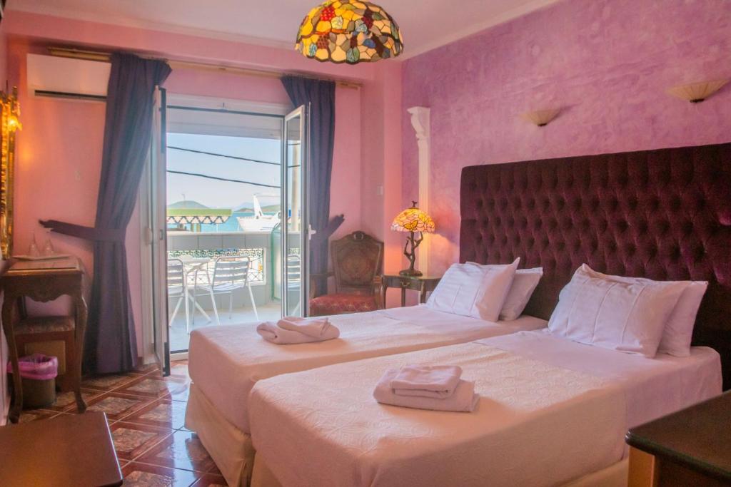 Postel nebo postele na pokoji v ubytování Hotel Astoria