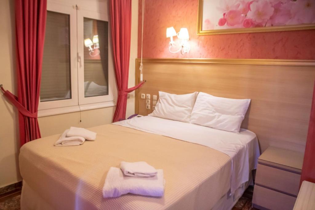 Postel nebo postele na pokoji v ubytování Hotel Astoria