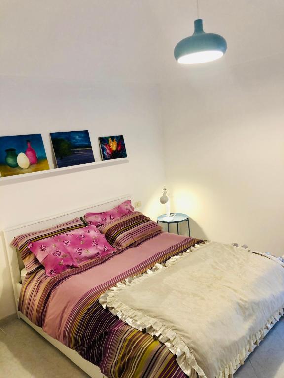 Łóżko lub łóżka w pokoju w obiekcie La casa di Nonna Clo, nel centro di Vasto