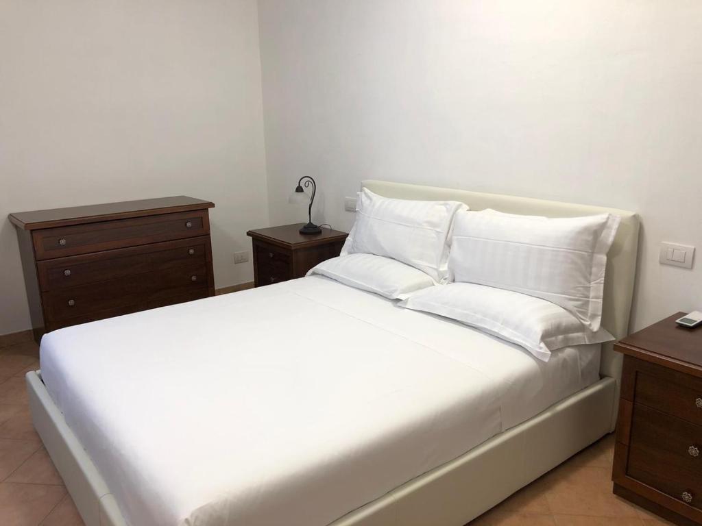 Postel nebo postele na pokoji v ubytování B&B Giulia