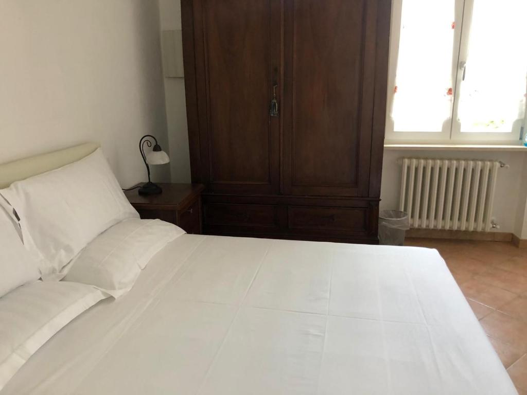 Postel nebo postele na pokoji v ubytování B&B Giulia