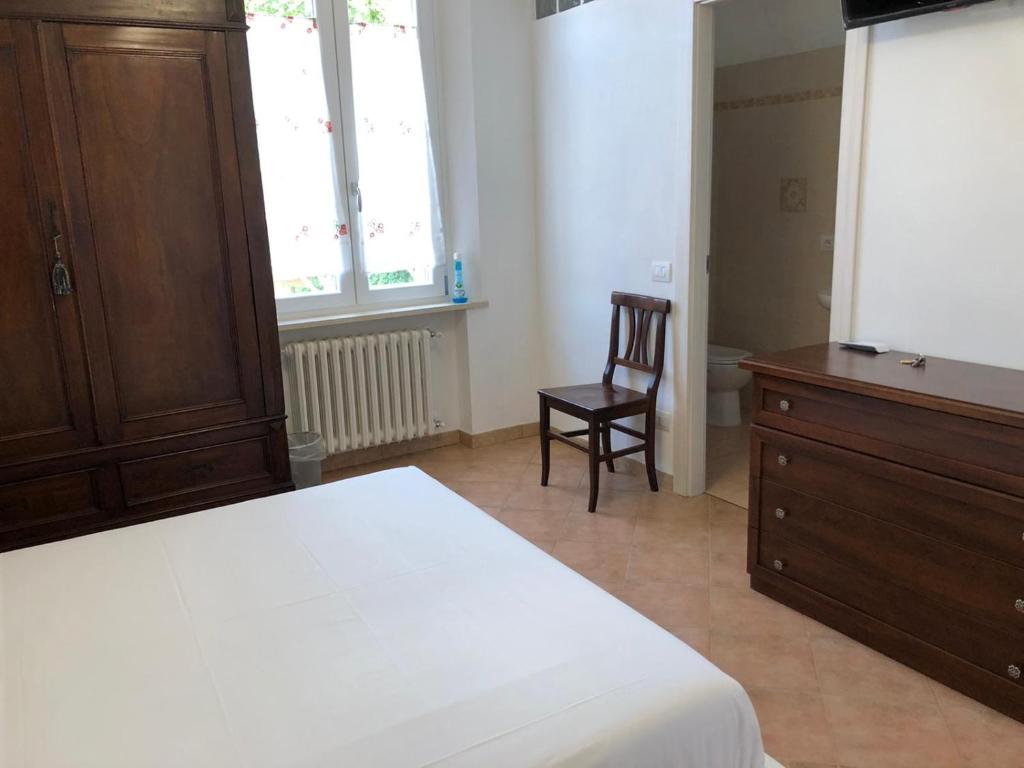 Postel nebo postele na pokoji v ubytování B&B Giulia