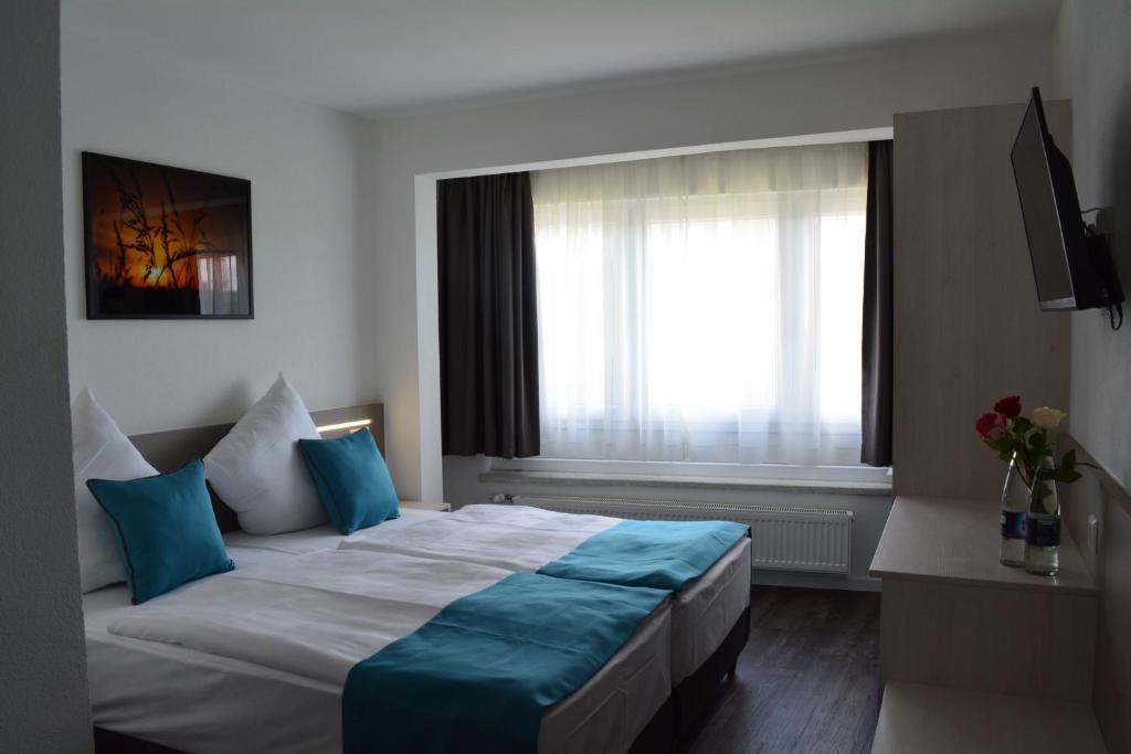 Voodi või voodid majutusasutuse Hotel BaWü toas