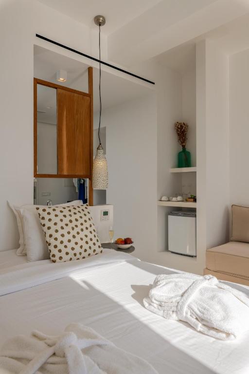 Postel nebo postele na pokoji v ubytování Bluetopia Suites