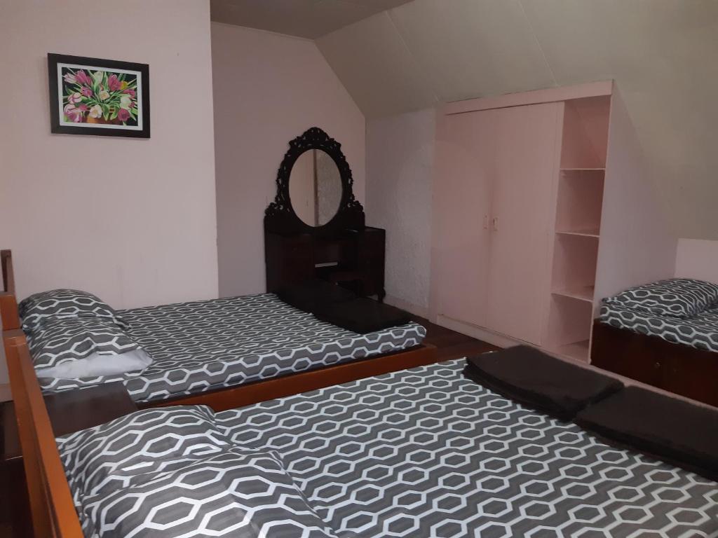 Postel nebo postele na pokoji v ubytování Zya 3BR A-House