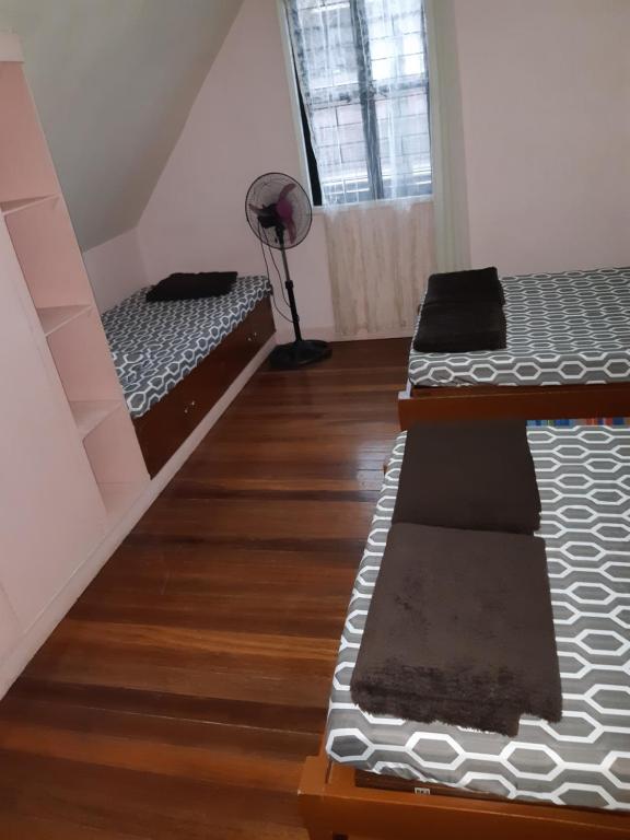 Postel nebo postele na pokoji v ubytování Zya 3BR A-House