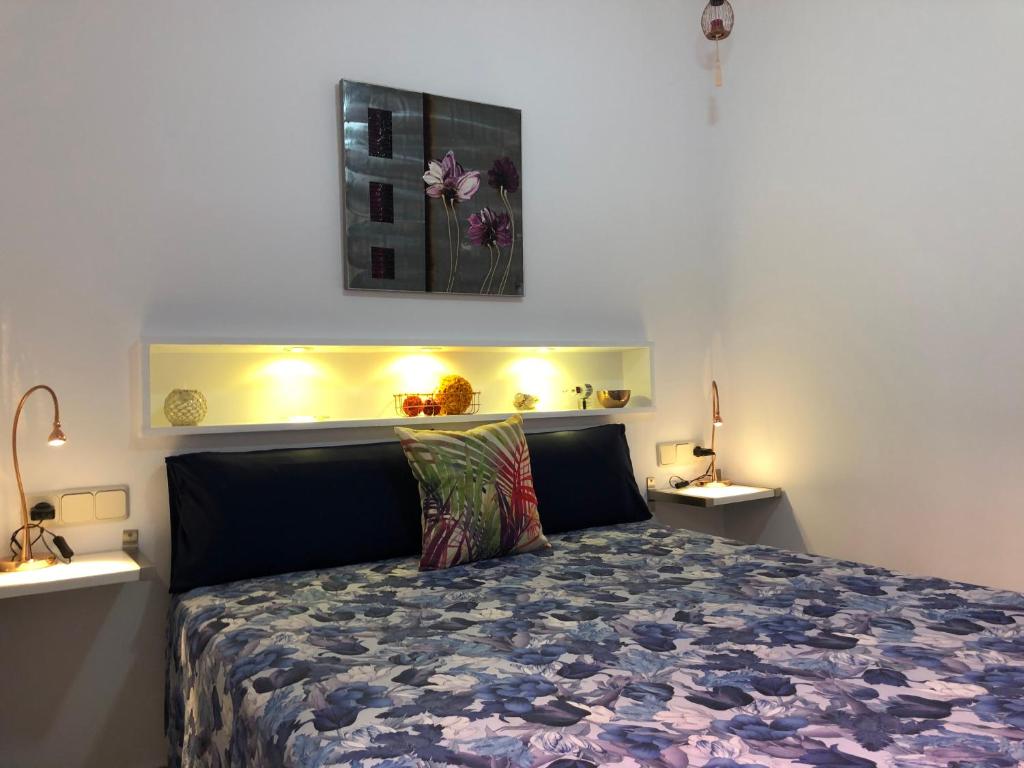 Кровать или кровати в номере Apartamentos casa Tia Antonia