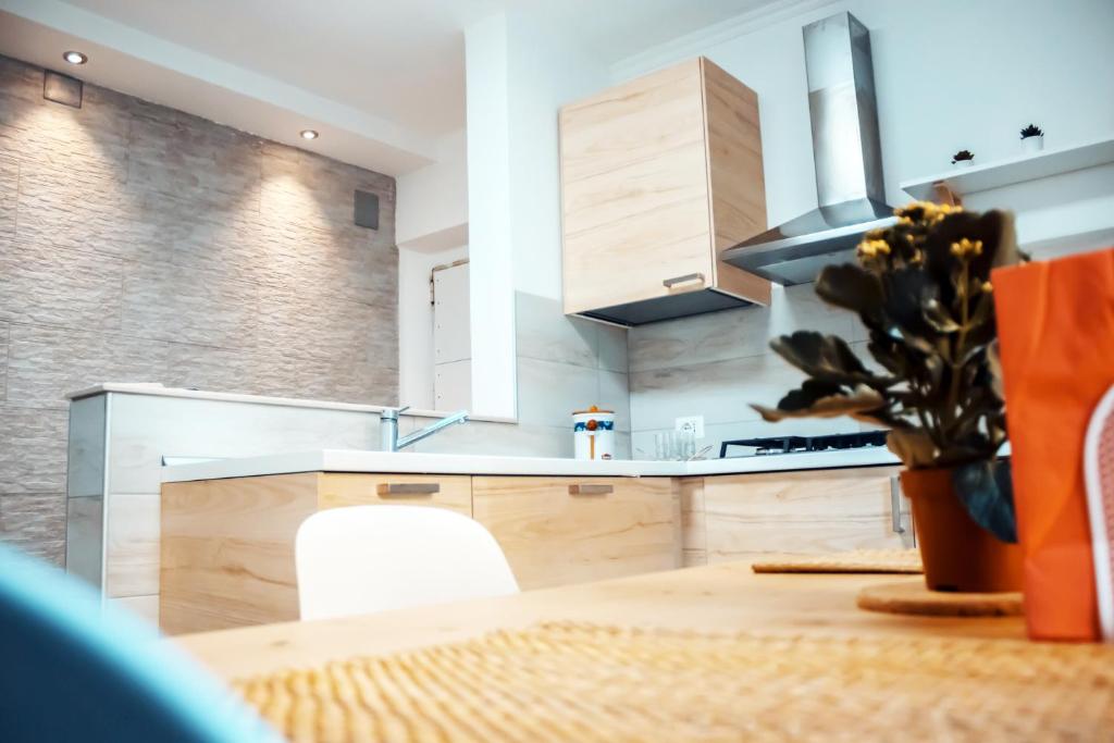 a kitchen with a wooden table and a stove at APPARTAMENTO TORRESI 2 in Ancona