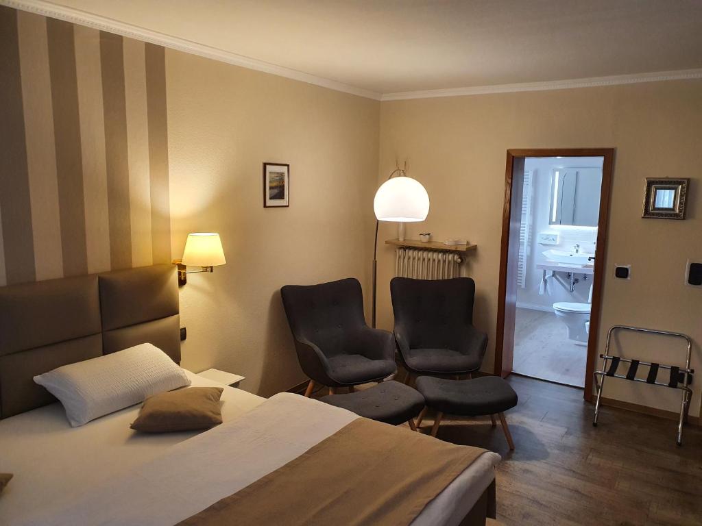 Postel nebo postele na pokoji v ubytování Hotel Garni Eichhornkobel