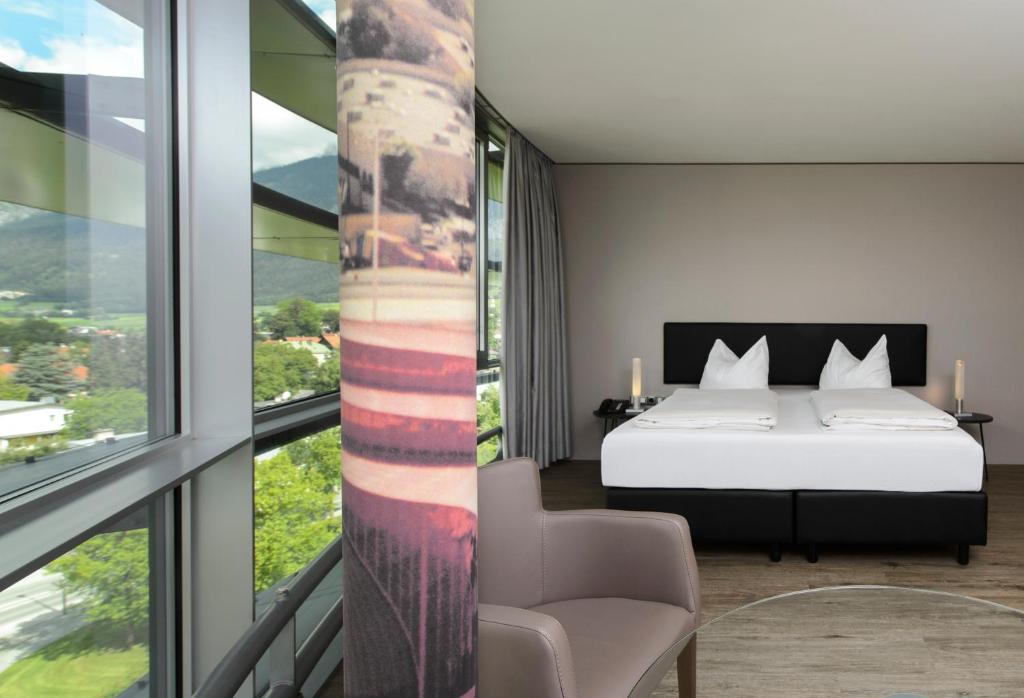 Postel nebo postele na pokoji v ubytování Parkhotel Hall in Tirol