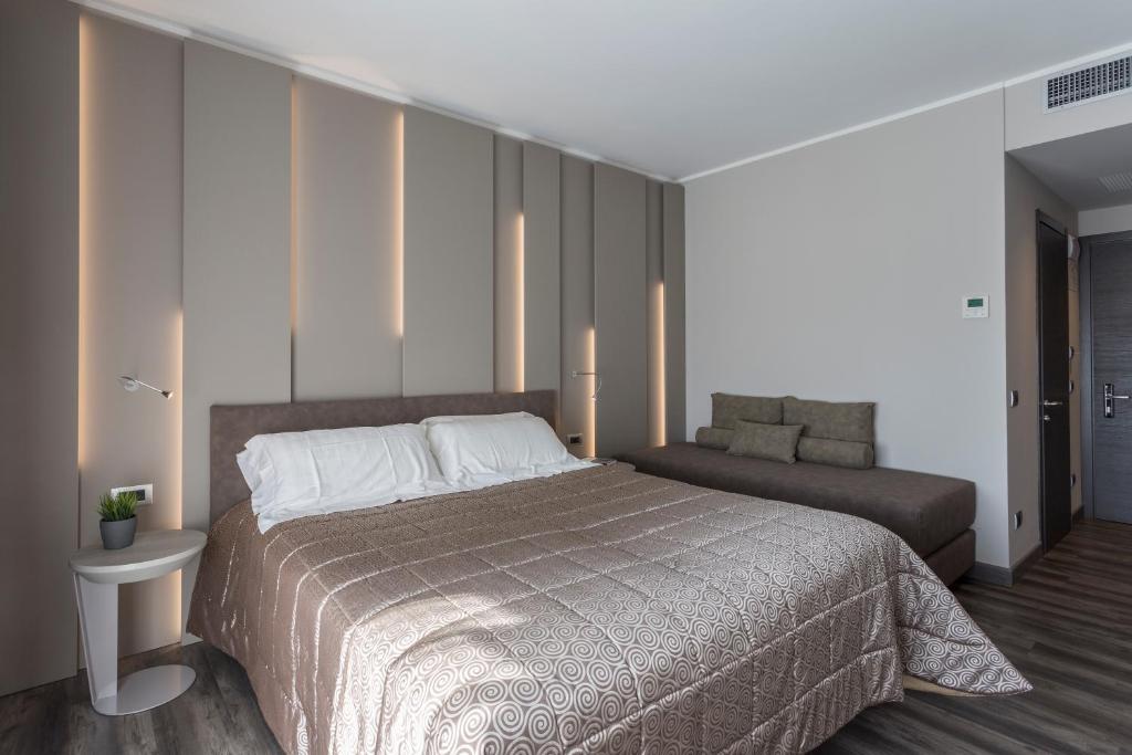 Een bed of bedden in een kamer bij Hotel Giulietta Romeo