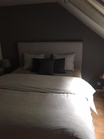 Een bed of bedden in een kamer bij B&amp;B De Notelaar
