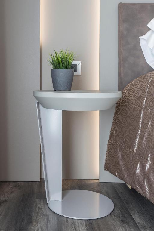 Een bed of bedden in een kamer bij Hotel Giulietta Romeo