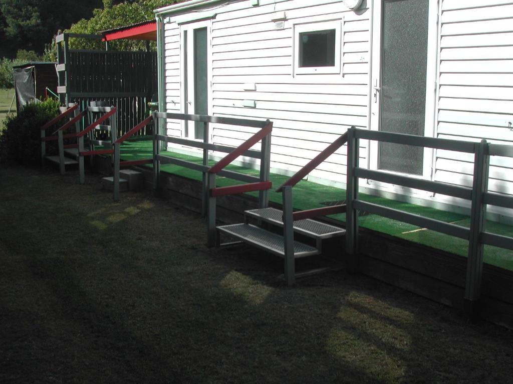 a group of stairs next to a building at mobil home dordogne in Mouzens