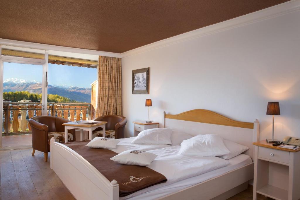 Postel nebo postele na pokoji v ubytování Hotel Etrier
