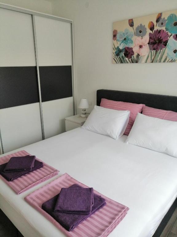 Postel nebo postele na pokoji v ubytování Apartments M&B