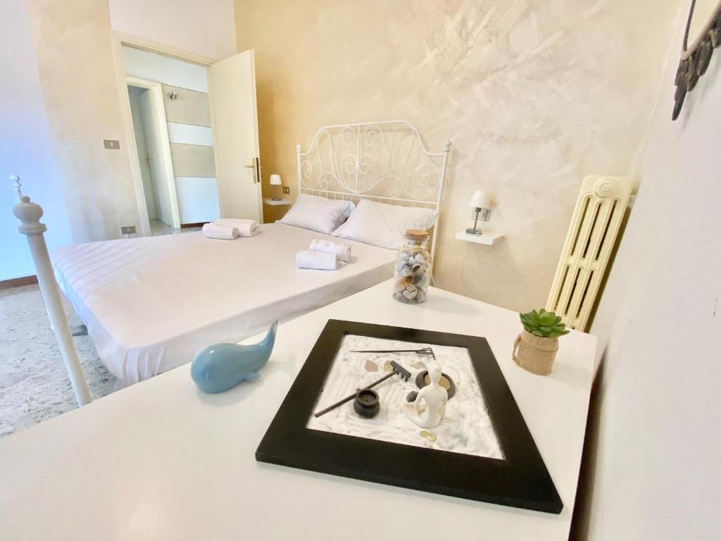 Postel nebo postele na pokoji v ubytování Isa Sirmione Apartments