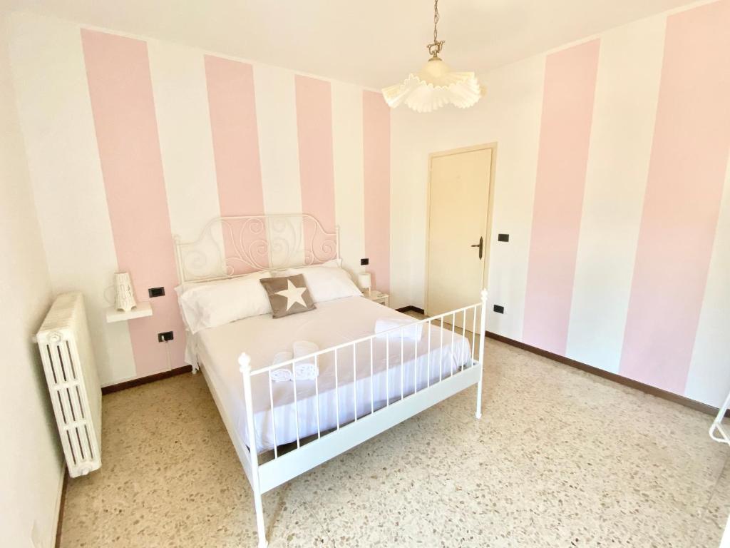 Postel nebo postele na pokoji v ubytování Isa Sirmione Apartments