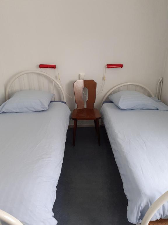 Postel nebo postele na pokoji v ubytování Hostel Pension Tivoli