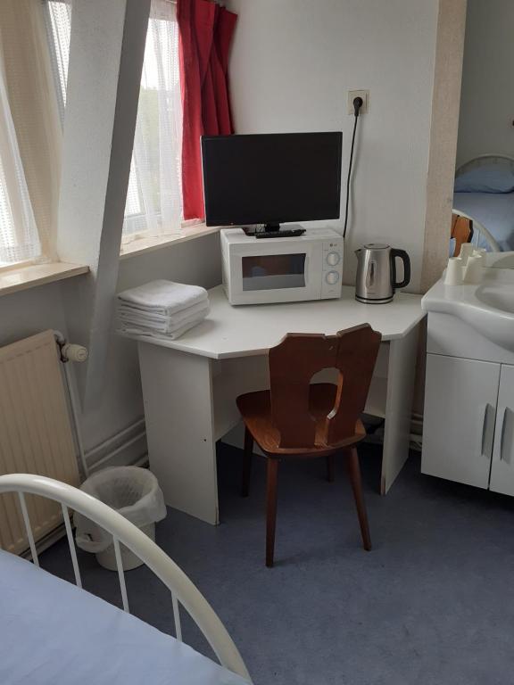 Postel nebo postele na pokoji v ubytování Hostel Pension Tivoli