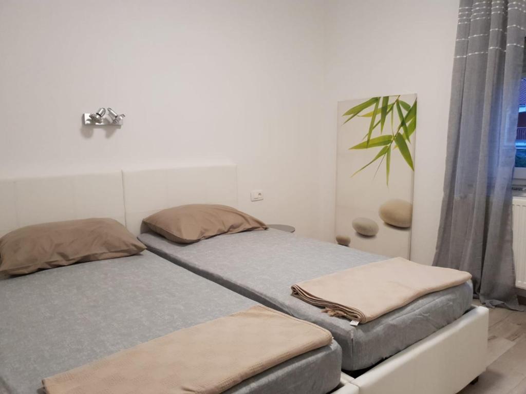 Posteľ alebo postele v izbe v ubytovaní Apartman Bitunjac