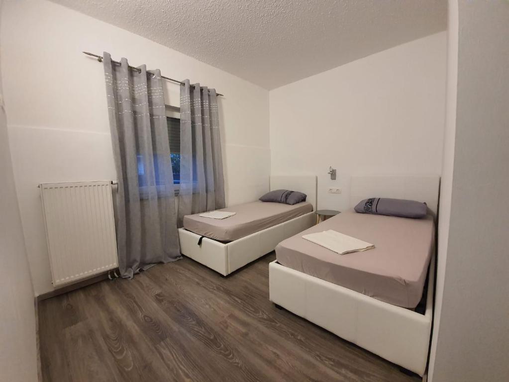 Posteľ alebo postele v izbe v ubytovaní Apartman Bitunjac