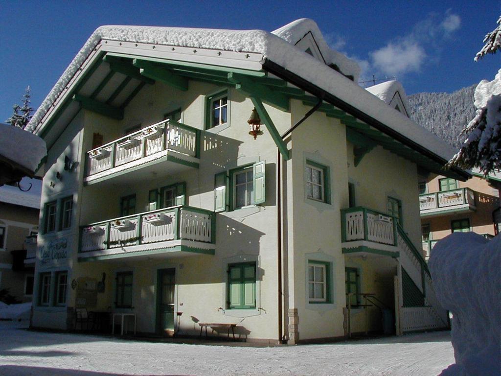 a large building with balconies on the side of it at Ciapià in Campitello di Fassa