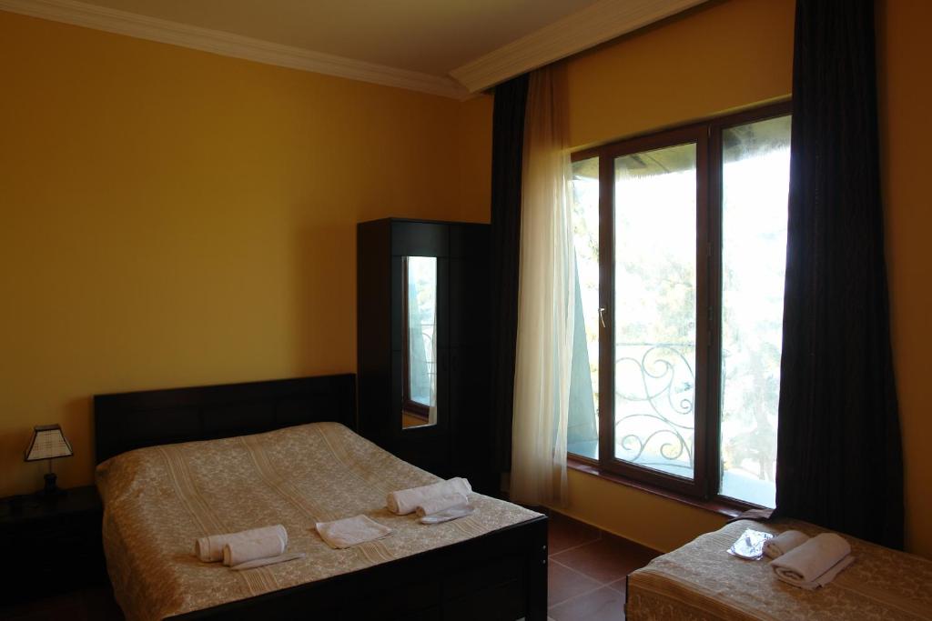 Postel nebo postele na pokoji v ubytování Marshal Resort Kobuleti