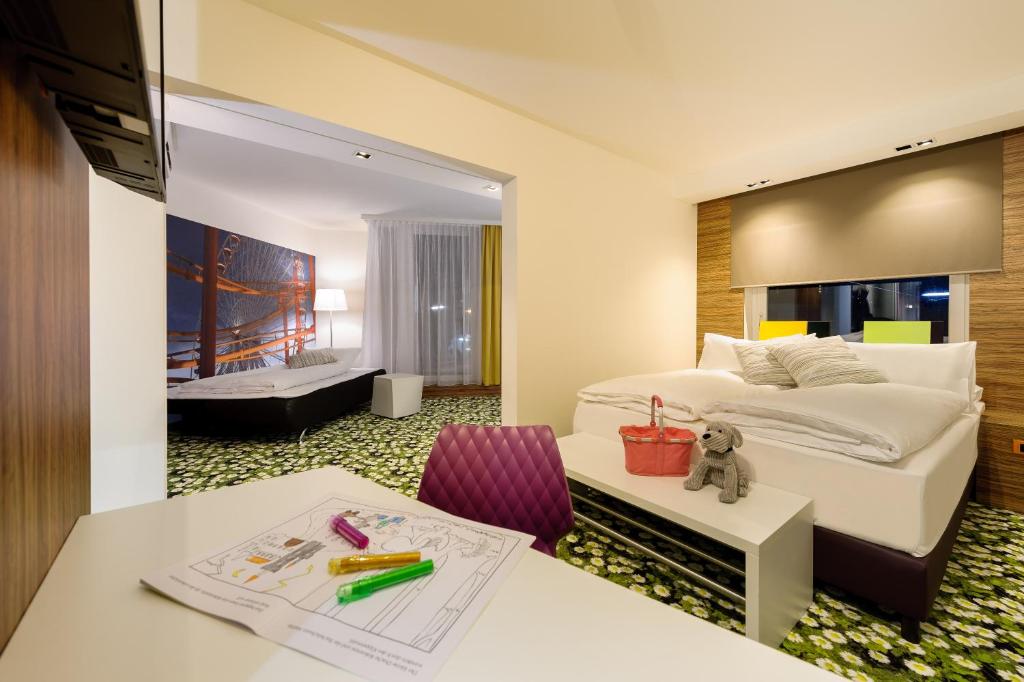 Łóżko lub łóżka w pokoju w obiekcie Ibis Styles Wien City
