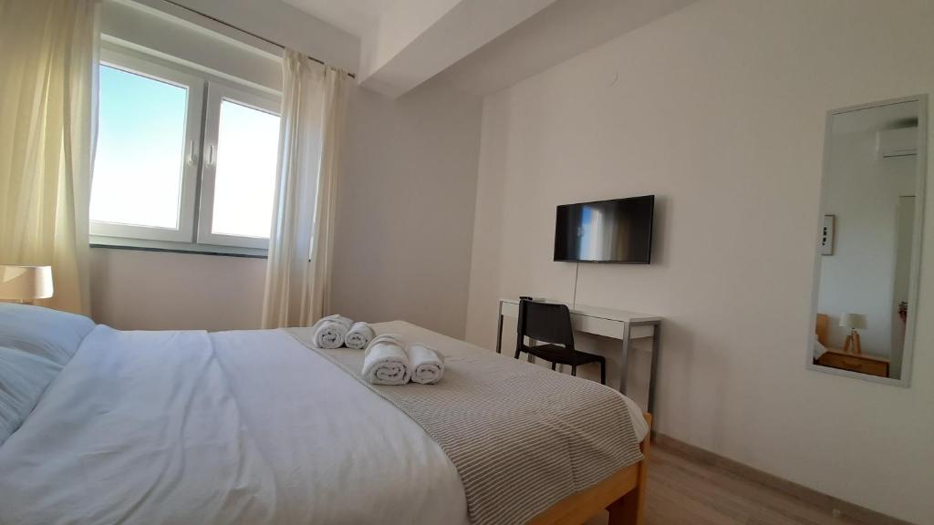 Posteľ alebo postele v izbe v ubytovaní Posteja Rooms