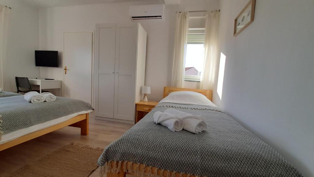 Posteľ alebo postele v izbe v ubytovaní Posteja Rooms