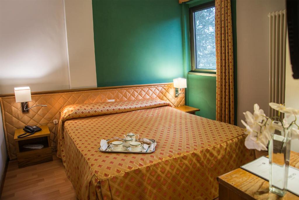 Postel nebo postele na pokoji v ubytování Hotel Giubileo