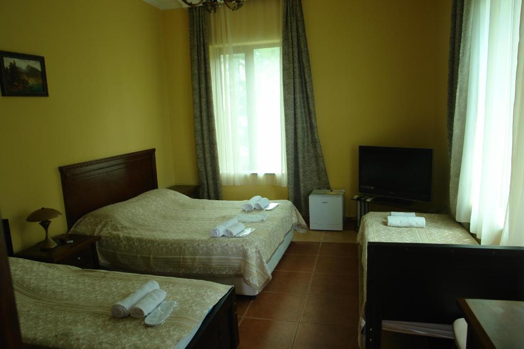 Postel nebo postele na pokoji v ubytování Marshal Resort Kobuleti