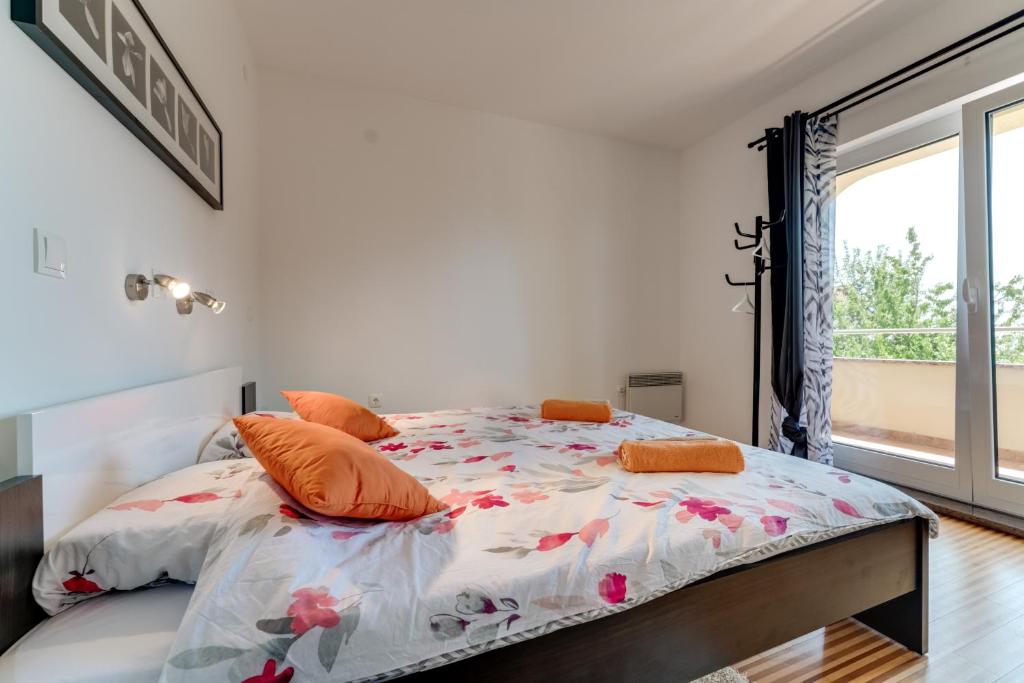 Łóżko lub łóżka w pokoju w obiekcie House ARIFRAGO