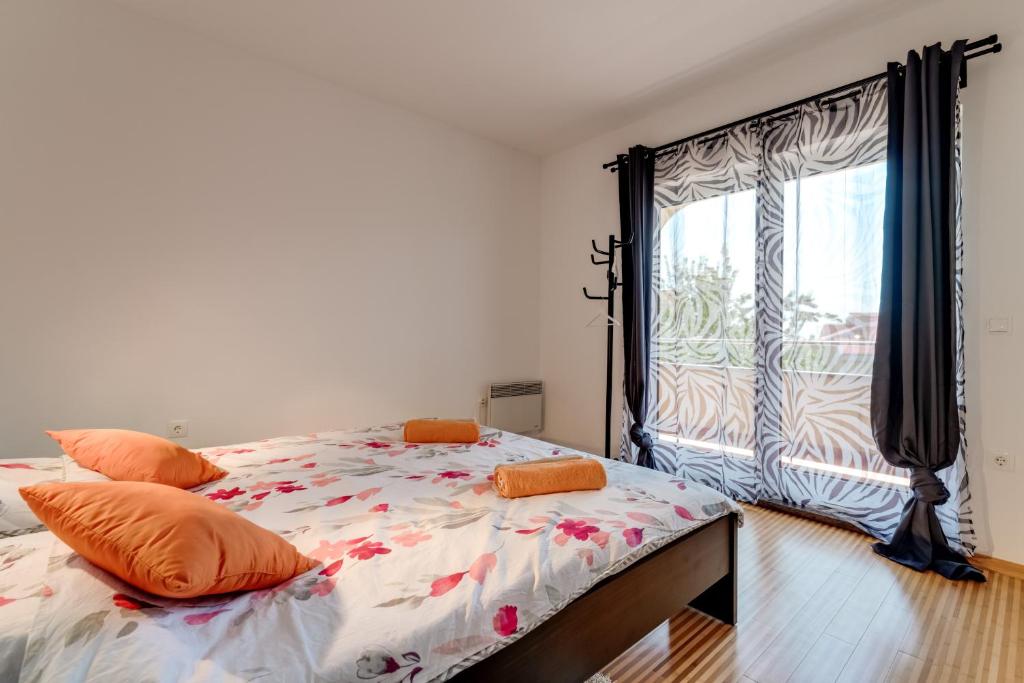 Łóżko lub łóżka w pokoju w obiekcie House ARIFRAGO
