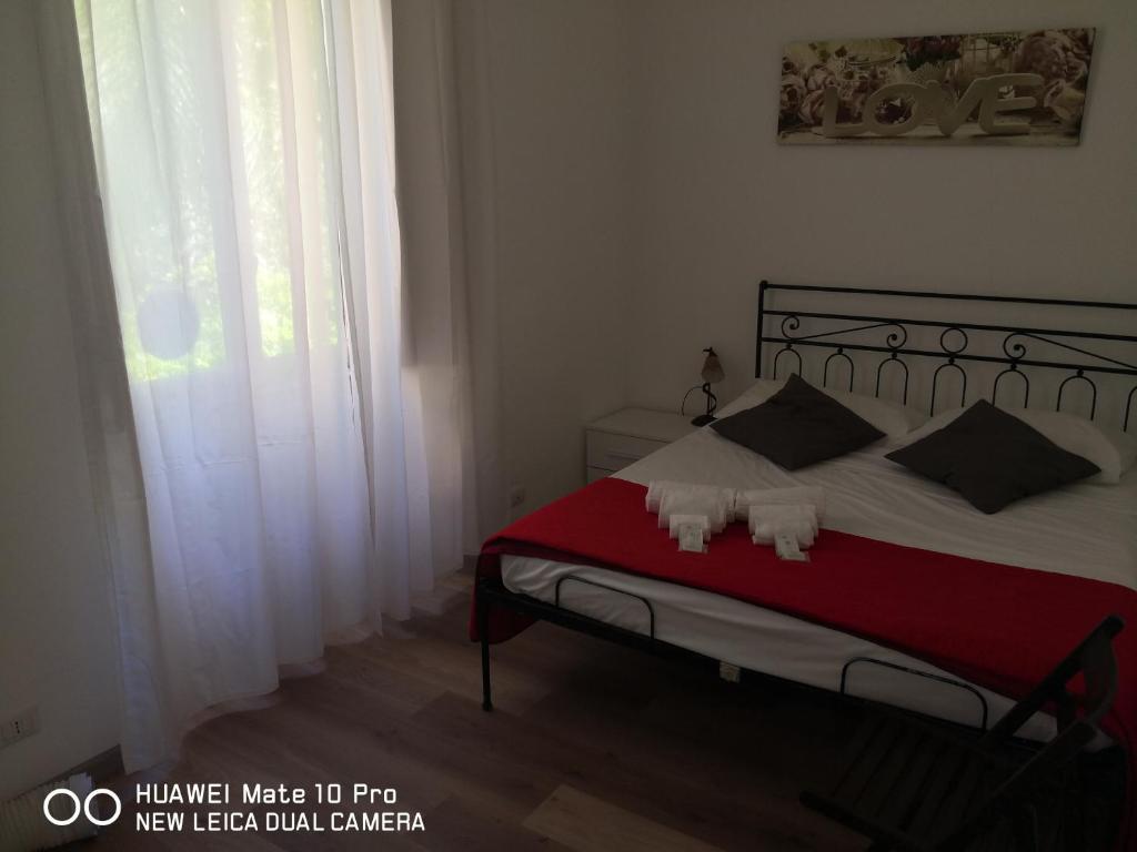 Łóżko lub łóżka w pokoju w obiekcie Trastevere four seasons Glorioso