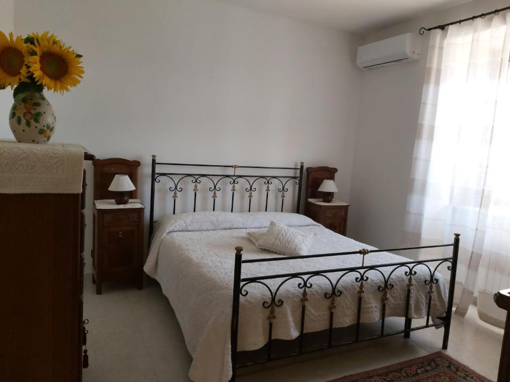 Postel nebo postele na pokoji v ubytování Cascina il Volo