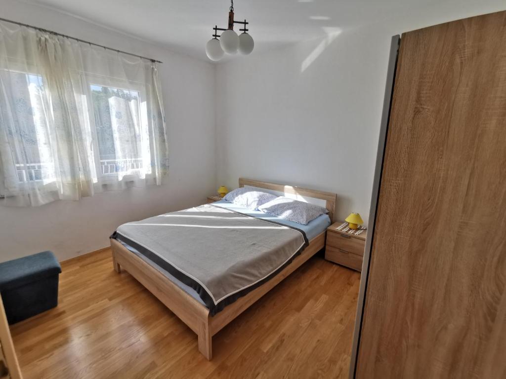 Postel nebo postele na pokoji v ubytování Apartment Slavica