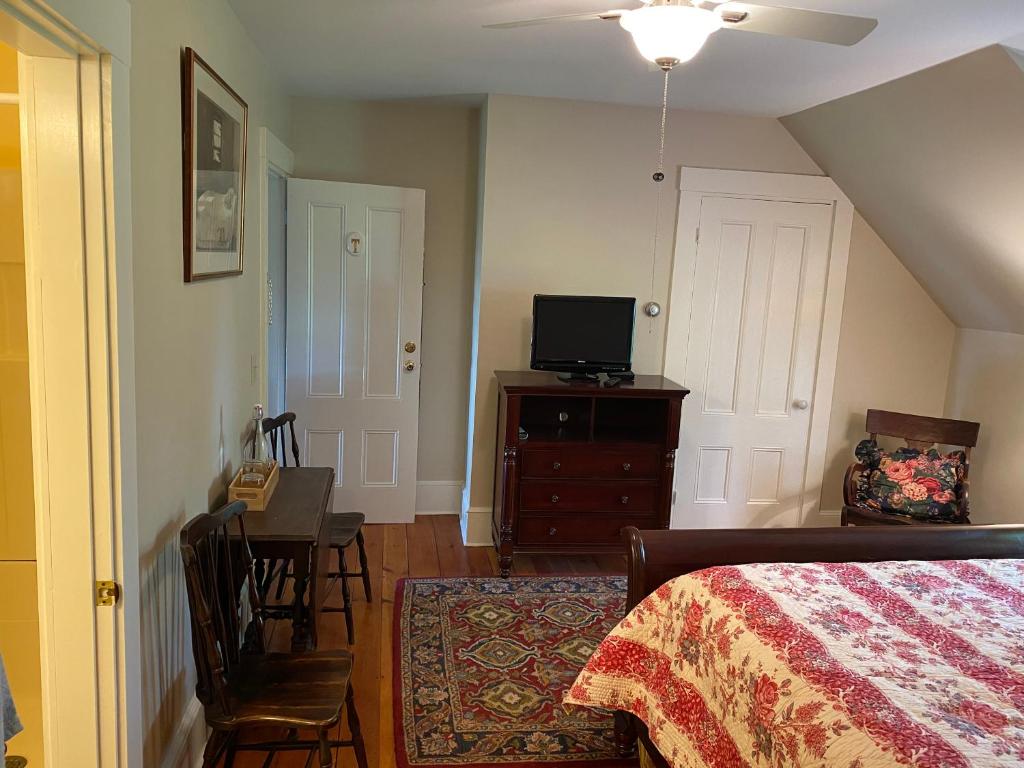 A television and/or entertainment center at James Place Inn Bed and Breakfast