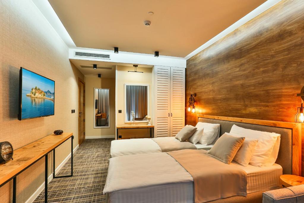 Postel nebo postele na pokoji v ubytování Boutique Hotel Tate By Aycon