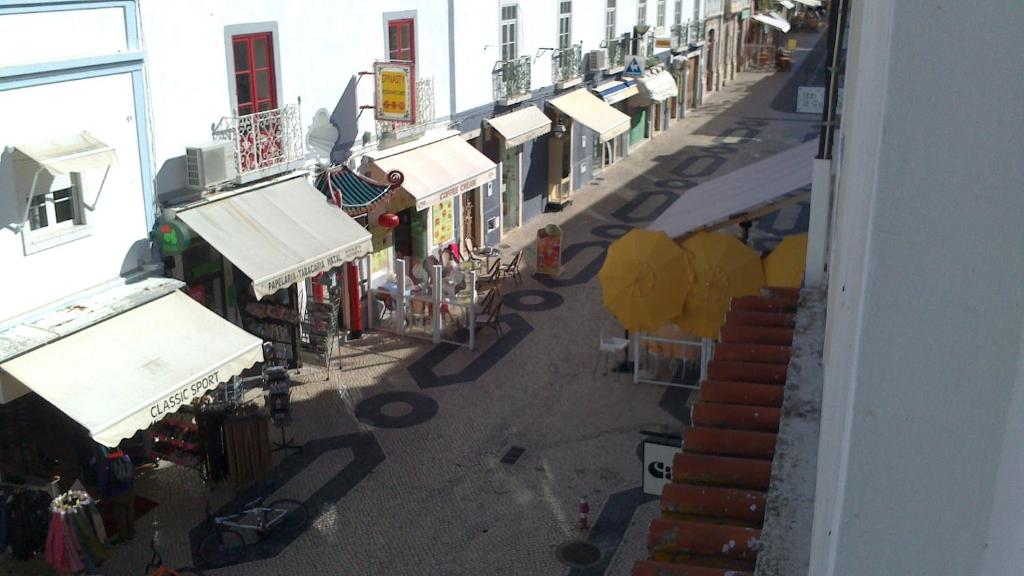 an overhead view of a street with shops and buildings at Caravela in Lagos